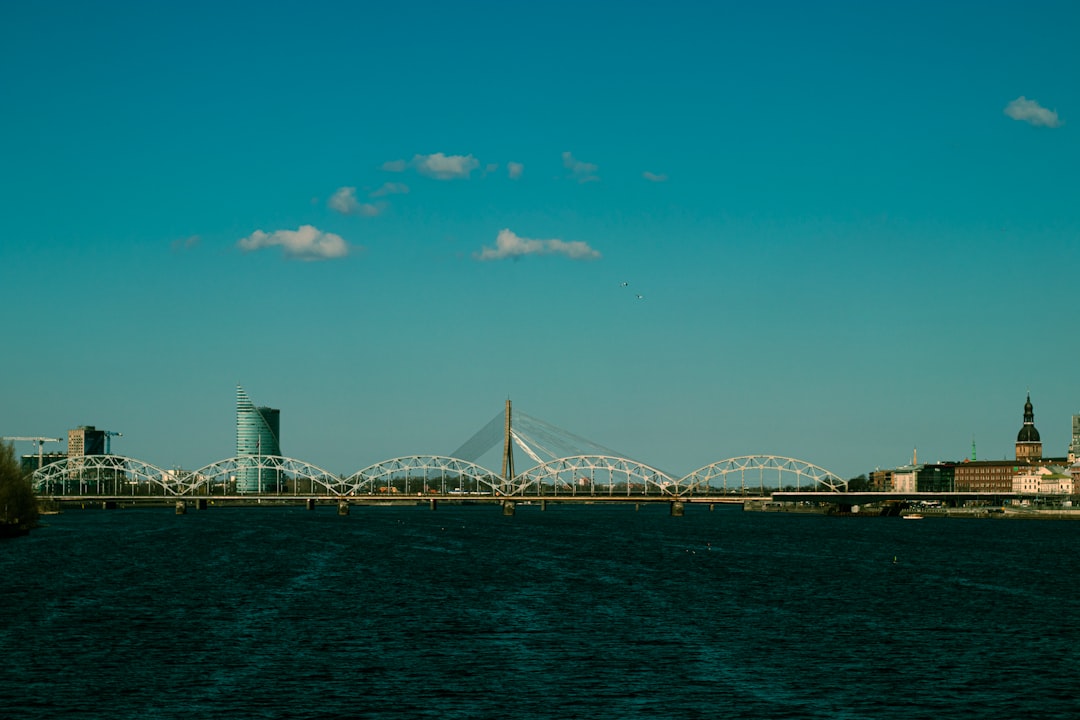 City skyline with a bridge over dark water